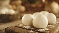 Soft Cheese on a wooden board with a rustic background